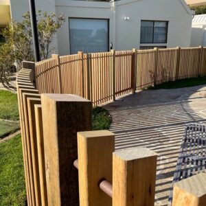 copper and wood round pool fence.