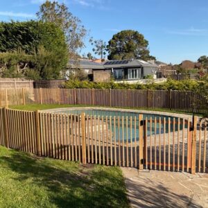 copper and wood pool fence